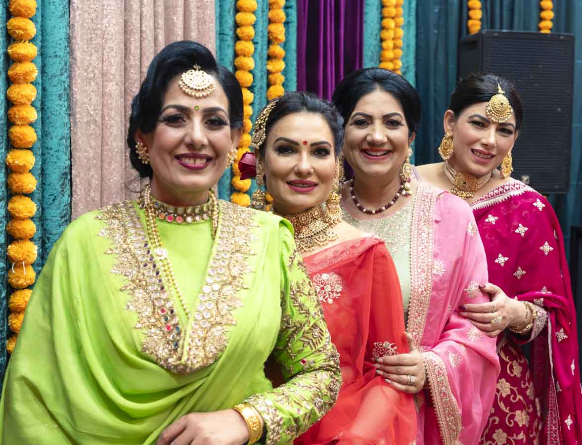 Capture joyous moments in our studio space featuring a quartet of ladies radiating happiness in exquisite Indian attires, adorned with traditional jewelry. Ideal for photo shoots, small events or workshops that celebrate diversity and culture.