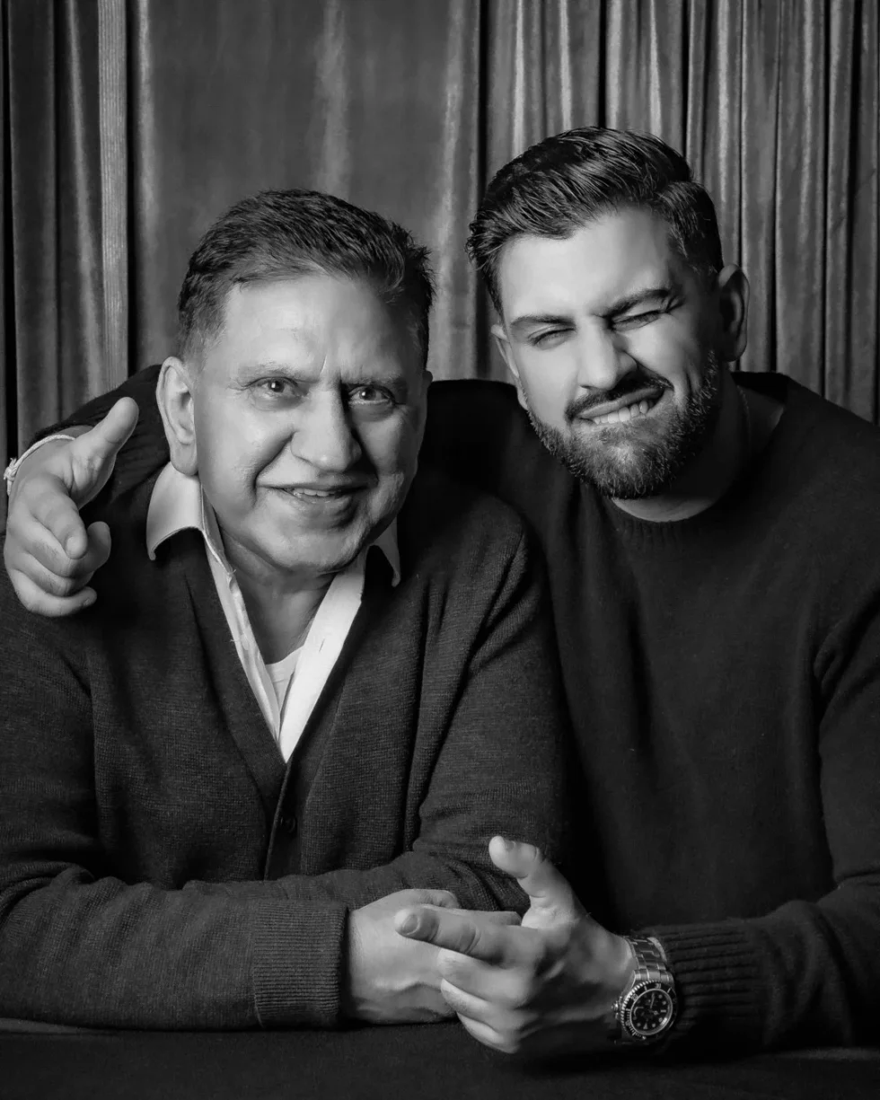 Father and son sharing a candid moment in a portrait booth session